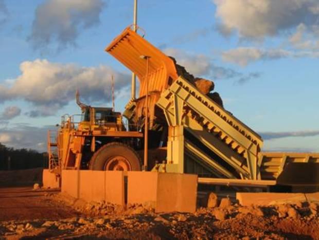The Haul trucks emptying run of mine (ROM) bauxite into crushers for the initial stages of comminution